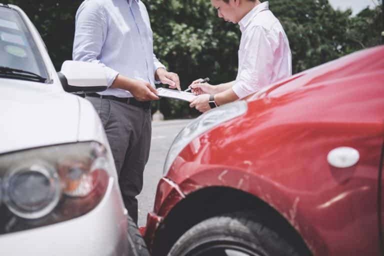 61909 437 insurance agent examine damaged car and customer filing signature on report claim form process after t20 VL9777