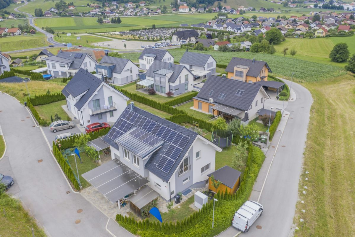 High angle shot of private houses with solar panels on the roofs