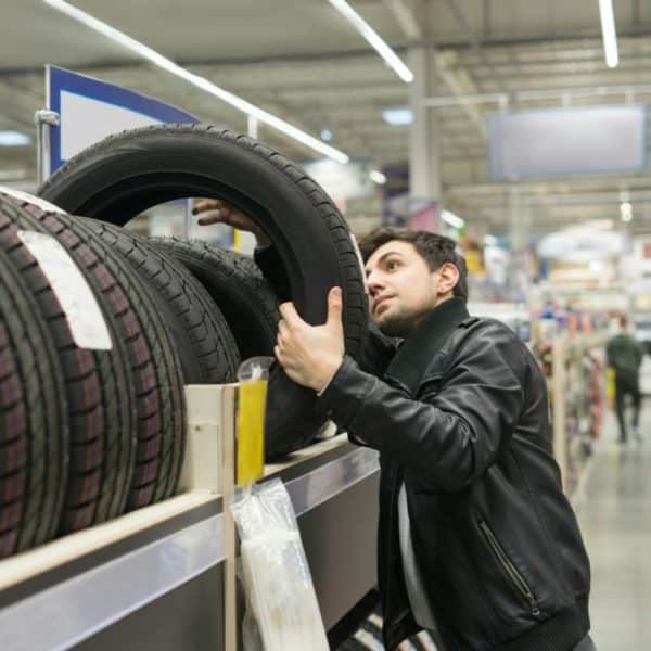 male customer choosing new tires