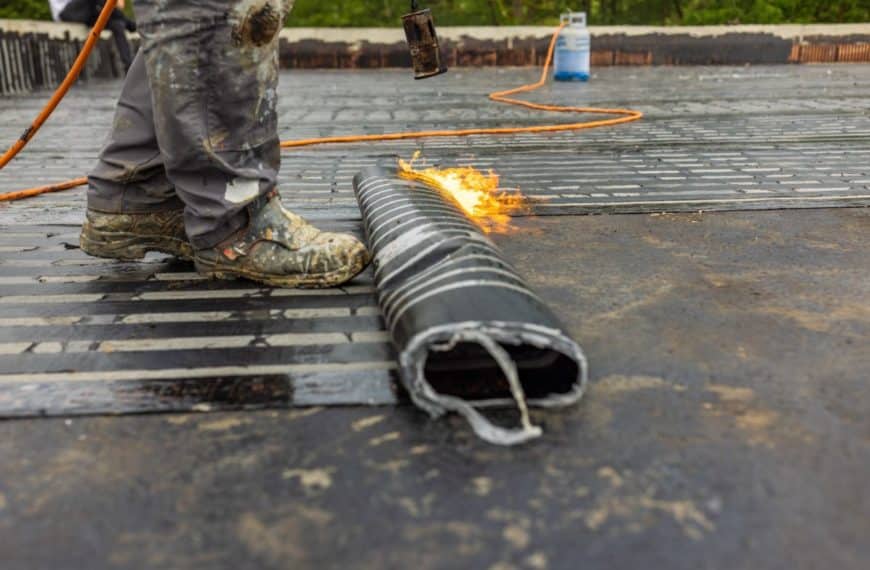 Bituminous membrane waterproofing system details and installation on flat rooftop.
