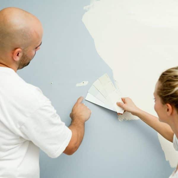 Couple choosing paint colors for a home renovation project