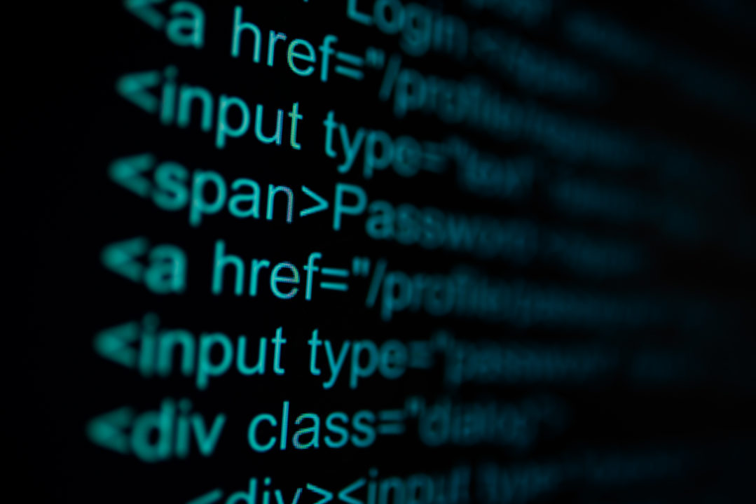 Gros Plan D'un écran D'ordinateur Affichant Du Code Html, Y Compris Des éléments Tels Que Les Balises Input, Span Et Div.